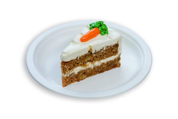 homemade carrot cake on white paper plate and background.