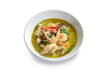 Green curry with  shrimp and meat on white background.