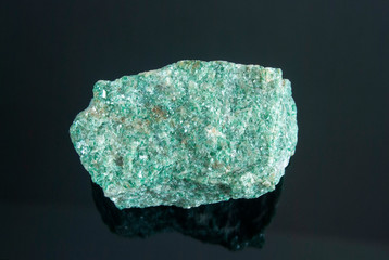 Macro shooting of natural mineral rock specimen - raw listvenite (Listwanite) stone. Origin:...
