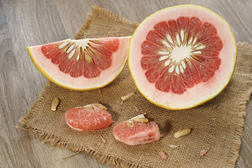 fresh garefruit orange on burlap background