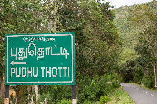 Road sign in Ghat road along the mountain range of Talamalai Reserve Forest, Hasanur, Tamil Nadu - Karnataka State border, India