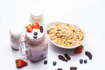 Healthy breakfast with  yogurt corn flake with milk and berries i