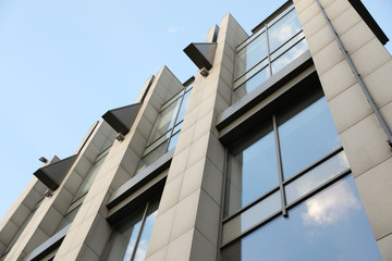 Modern office building with tinted windows on sunny day
