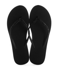 Pair of stylish flip flops on white background