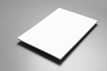 Blank paper sheets for brochure on grey background. Mock up