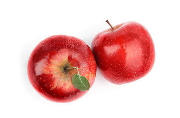 Ripe juicy red apples with leaf on white background, top view