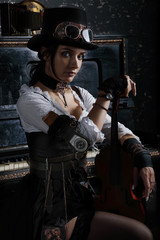Pretty steampunk girl sitting next to the piano