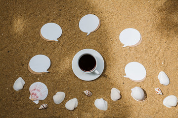 Coffee with note paper and seashell