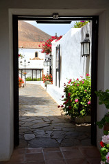 Flower Decorated Alley with White Houses in Betancuria, Fuerteventura