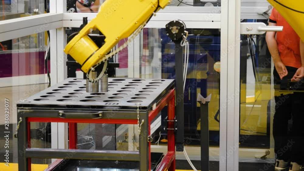 Poster robotic sorting of detail. media. robotic arm distributes parts on the panel
