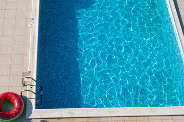 Fototapeta na wymiar Pool , watermelon swimming ring top view