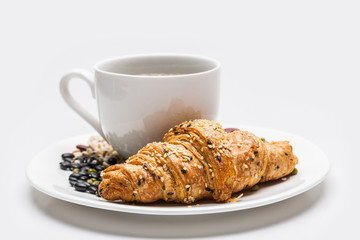 Croissant  with cereal and coffee isolated