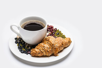 Croissant  with cereal and coffee isolated