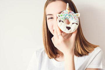 Beautiful girl holding donut