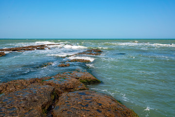 Rocky seashore and storm waves