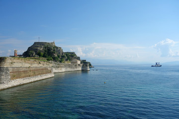 Fototapeta na wymiar View at Ionian sea in Corfu Town, ships, boats, canyon, old fortress