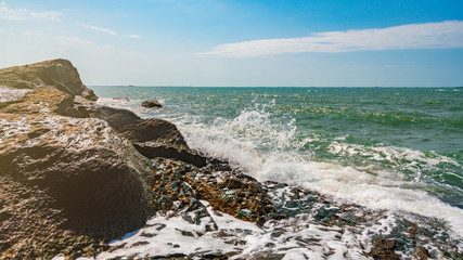 Fototapeta na wymiar Rocky seashore and storm waves