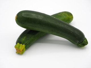 two zucchinis separated on white background