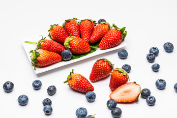 Fototapeta na wymiar Strawberry and blueberries isolated