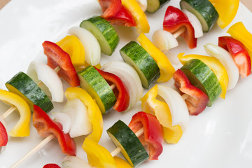 fresh raw vegetables on sticks for grill