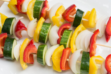 fresh raw vegetables on sticks for grill