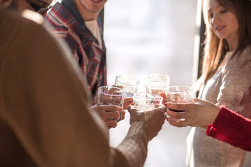 background image of a glass of juice in the hands of the young couple