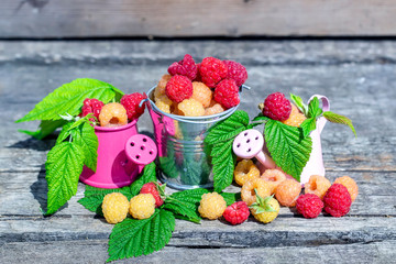 Ripe sweet raspberries on wooden table. Close up, top view, high resolution product.