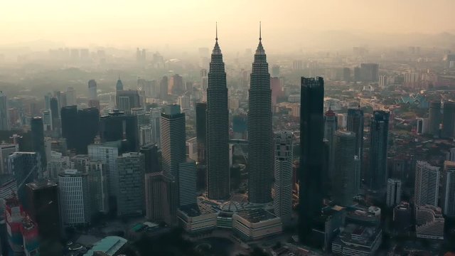 Drone Aerial view 4k Footage of Kuala Lumpur city skyline on sunset in Malaysia.	