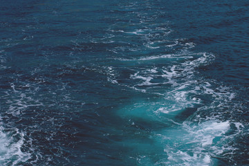 Naklejka premium Creative layout made of clear sea watersurface with kelvou jet, bubbles and waves on water surface with copy space, toned