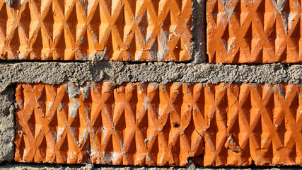 Bricks texture with lines and rhombuses, red wall, brickwork background for design