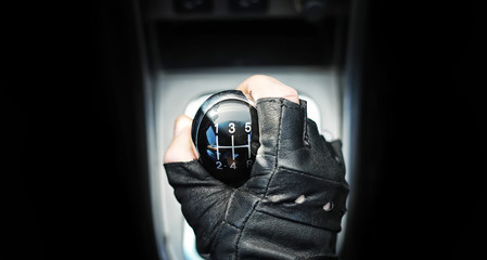 Gear lever. Manual Transmission. Hand on the gear shift in the car.
