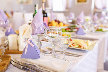 View of the served for decorated wedding dinner table. in elite restaurant with .Beautiful flowers