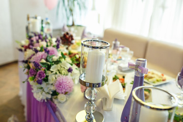 View of the served for decorated wedding dinner table. in elite restaurant with .Beautiful flowers