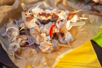 Chicken meat on sticks. Fried meat for dinner. Delicious food from the chef.
