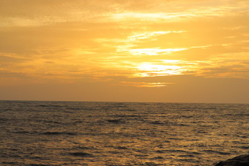 Fototapeta premium Sun set on a sea with orange sky