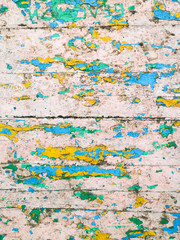 Old grunge vintage background: color wood surface with green blue whith yellow paint flaking