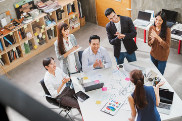 Group of Asian business people and creative designer meeting in office, top view