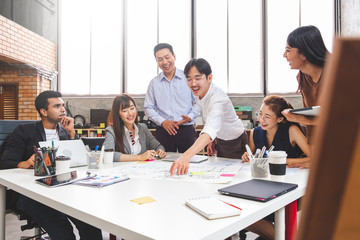 Group of Asian business people and creative designer meeting in office