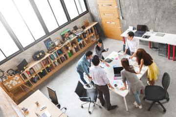 Group of Asian business people and creative designer meeting in office, top view