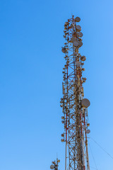 Telecommunication tower with the antennas or wireless Communication antenna transmitter against...