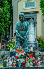 Marble statue and an ancient abandoned Gothic cemetery	