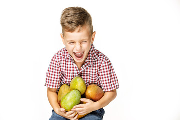 Fototapeta na wymiar handsome boy in a red shirt with a mango