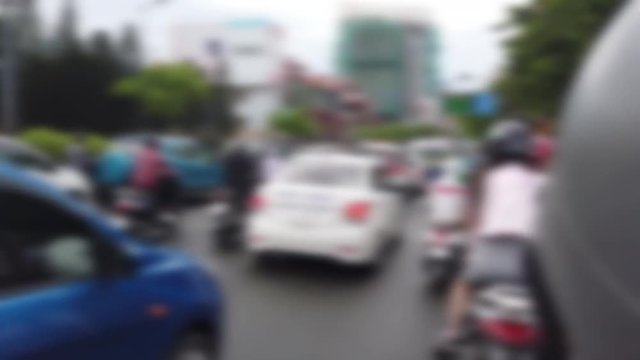 Blurred footage of transport in Ho Chi Minh. Travel in Ho Chi Minh city by a motorbike. Royalty high-quality free stock footage of slow moving traffic with lots of motorcycles, motorbike, bus, car