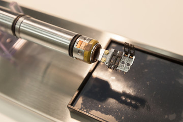 Fototapeta na wymiar Specimen holder accommodating up to 4 Transmission Electron Microscopy (TEM) grids, laboratory specialized in the detection of asbestos fibers