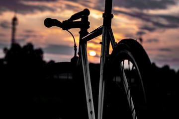 silhouette of man on bicycle