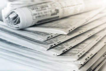Newspapers folded stack, the concept of world news