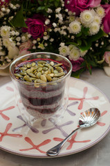 Chia Pudding on Milk with Black Currant and Bouquet
