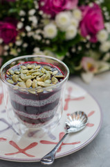 Chia Pudding on Milk with Black Currant and Bouquet