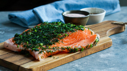 Gravlax or gravlaks is a Nordic dish consisting of raw salmon, cured in salt, sugar, and dill