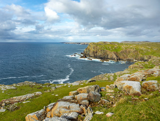 lush west coast of isle of Lewis, outer Hebrides in Scotland with dramatic cloudy sky